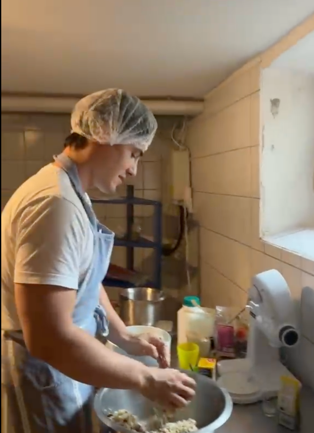 Founder mixing dough in the production kitchen